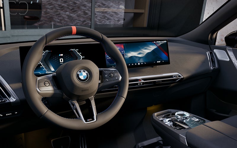 Interior steering wheel and dashboard of the BMW iX M70. | BMW of Lynnwood in Lynnwood WA