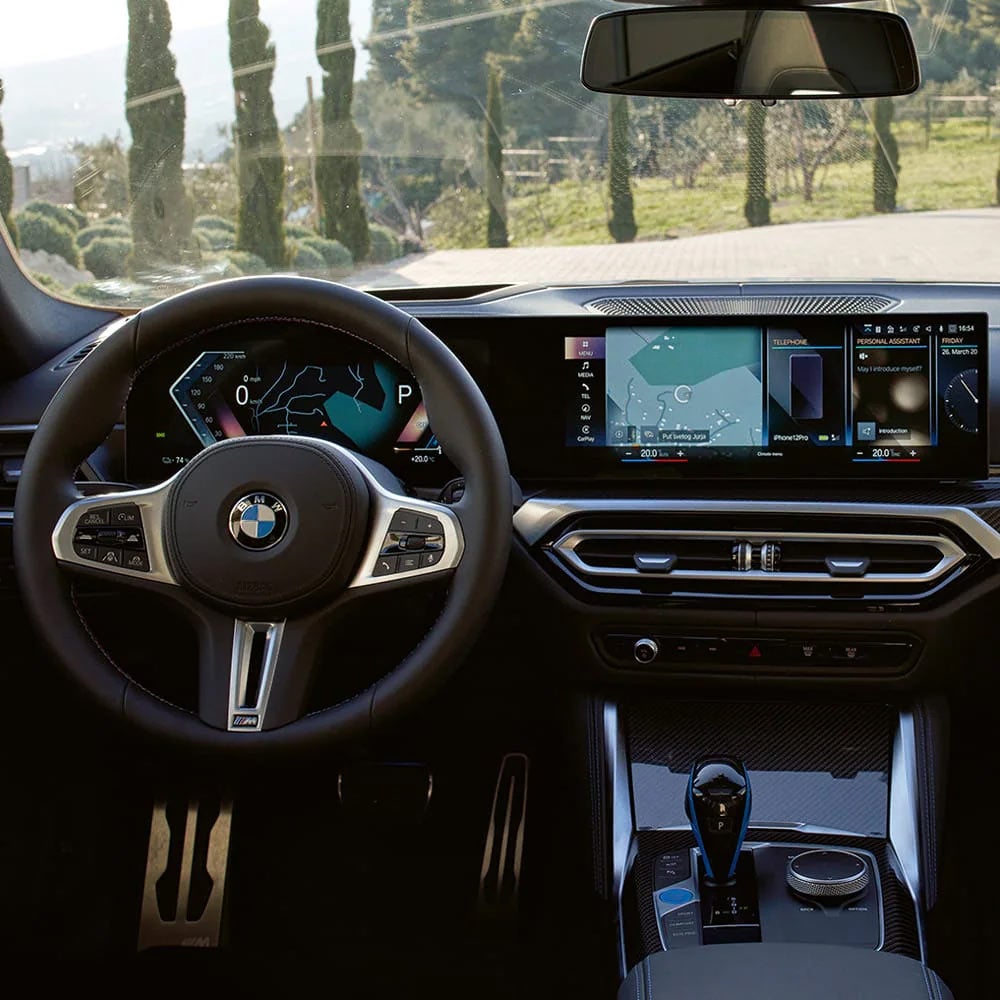 A driver's eye view of steering wheel and controls of the BMW i4 | BMW of Lynnwood in Lynnwood WA